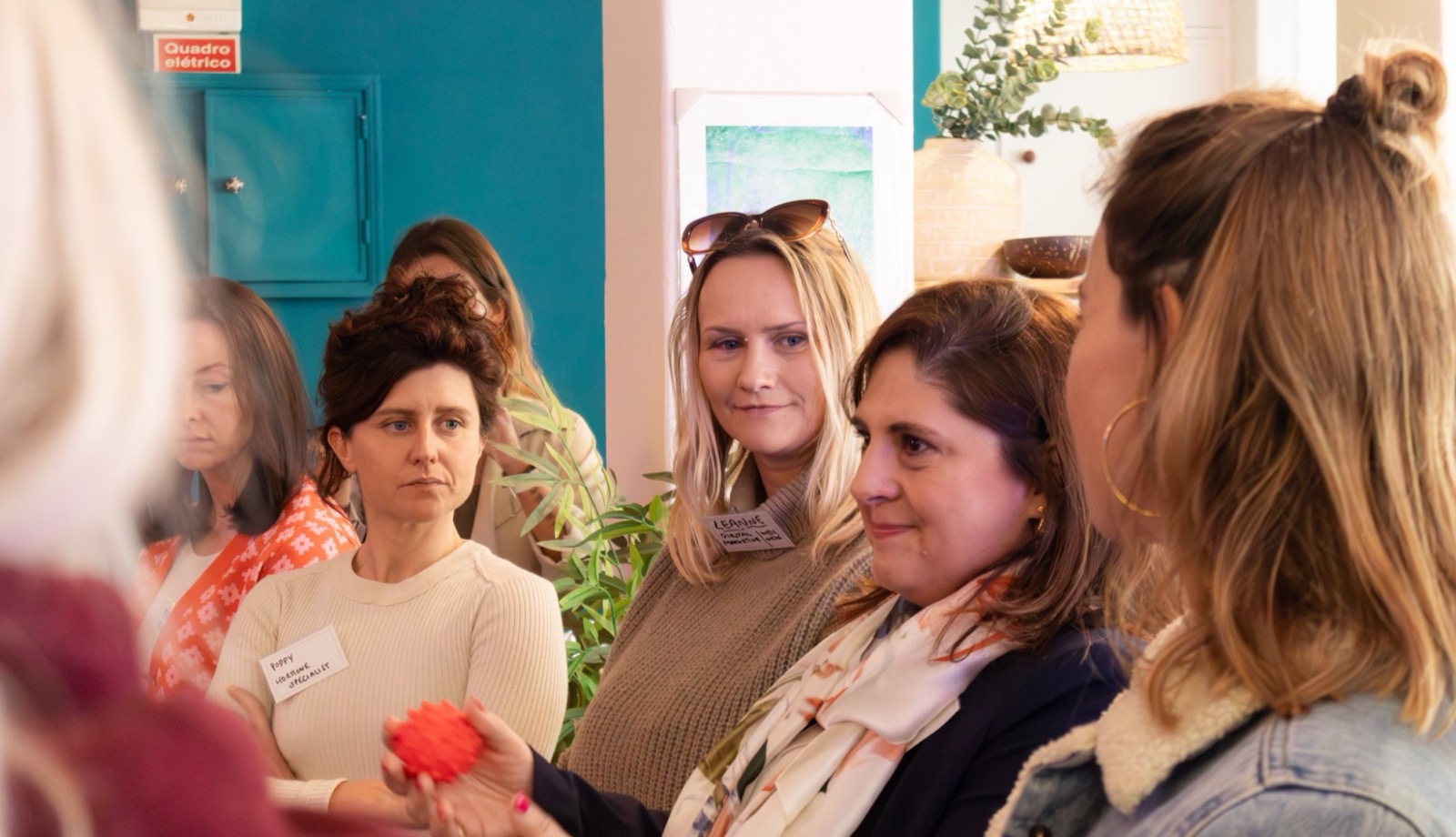 Women talking in a circle at a gathering