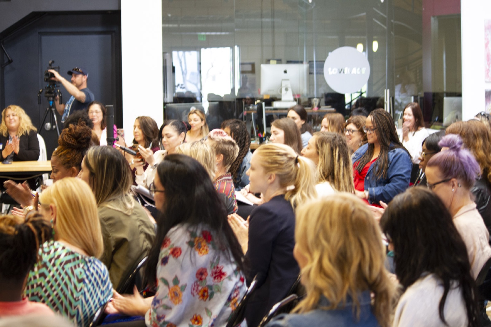 A packed room of women listening at Simone's 2018 summit