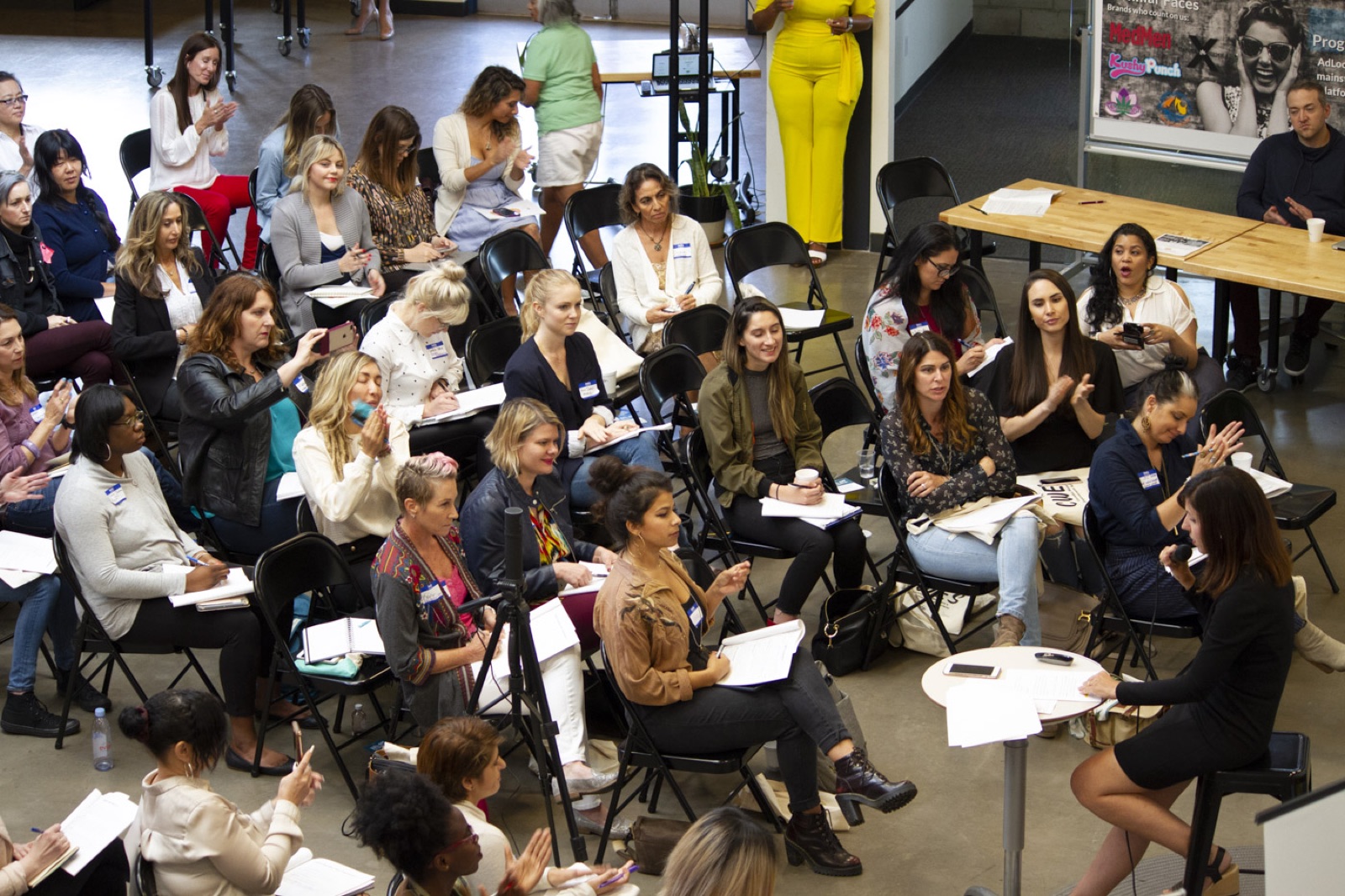 Women in small discussion circles at Simone's 2018 summit