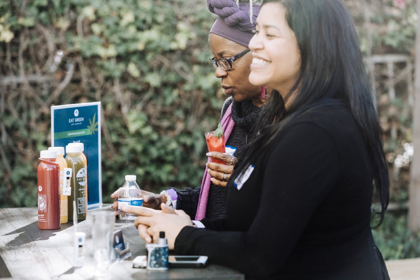 A guest sampling a partner's juices at Simone's 2018 summit